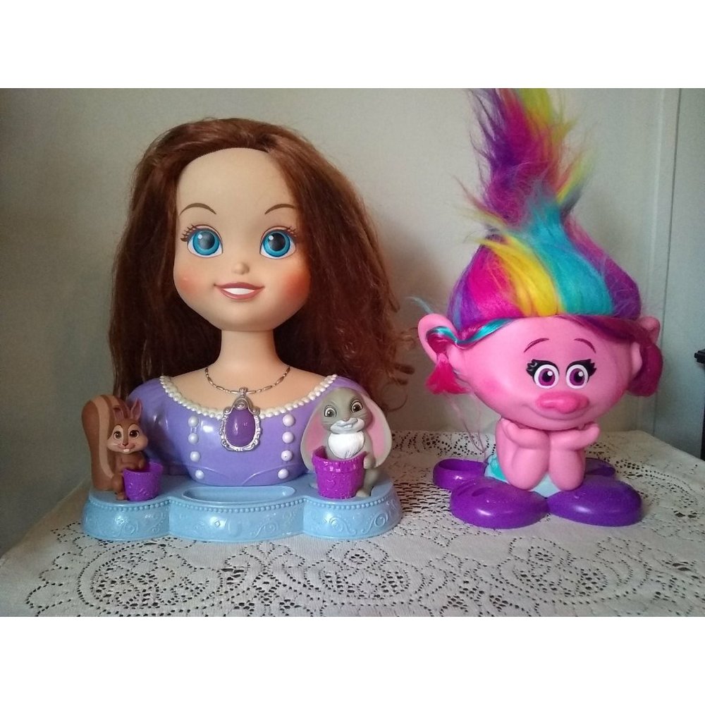 Two hairstyling doll heads Princess Sofia and Poppy troll